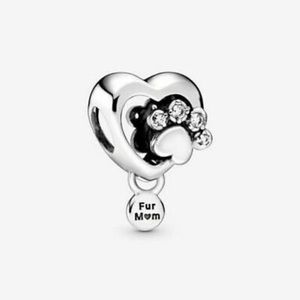 Pandora Sparkling paw print and heart charm. New with tags
